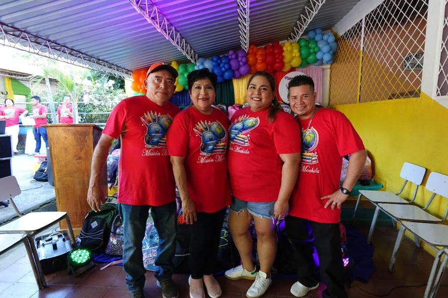 Volunteers in red shirts at the school