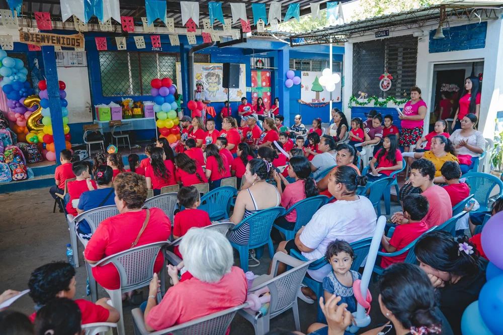Parents and grandparents seated at the celebration